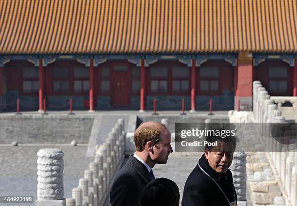 Prince William, Duke of Cambridge is guided by Chinese officials as he tours the Forbidden City on March 2, 2015 in Beijing, China. The Duke of...