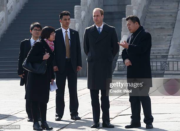 Prince William, Duke of Cambridge is accompanied by a museum officer during a visit to the Forbidden City on March 2, 2015 in Beijing, China. The...