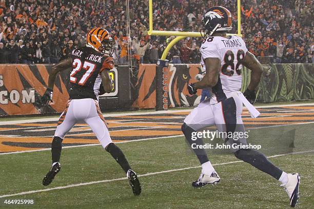 Dre Kirkpatrick of the Cincinnati Bengals returns the football against Demaryius Thomas of the Denver Broncos during their game at Paul Brown Stadium...