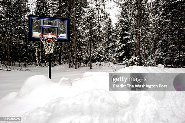 Basketball hoop in a neighborhood of the Lac Vieux Desert reservation in Watersmeet, MI on December 21, 2014. The community of Watersmeet and it's...