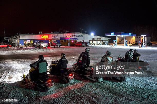 Snowmobilers outside Nordine's Plaza in Watersmeet, MI on December 20, 2014. The rural area provides extensive trails for snowmobiles and is home to...