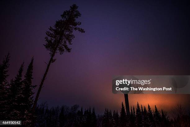 Lights from the Lac Vieux Desert Casino light up the horizon, behind a water tower on the Lac Vieux Desert reservation in Watersmeet, MI on December...