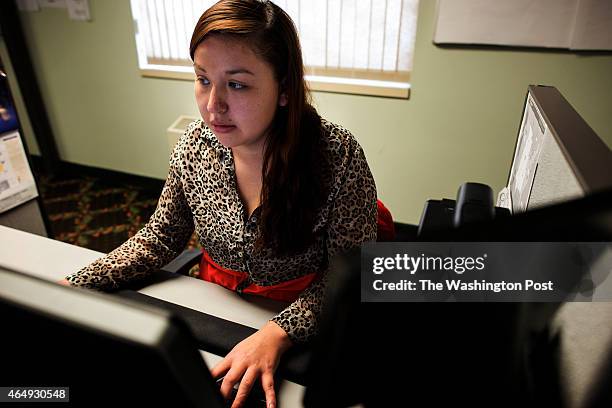 Employee Ashley White provides customer service online for Duck Creek Financial in Watersmeet, MI on December 20, 2014. White is a member of the Lac...