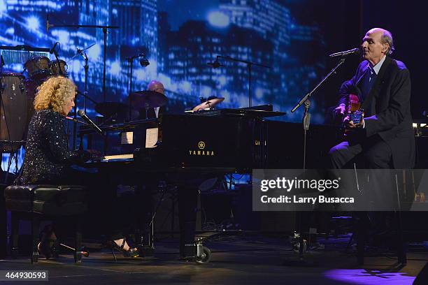 Honoree Carole King and recording artist James Taylor perform onstage at 2014 MusiCares Person Of The Year Honoring Carole King at Los Angeles...