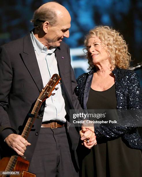 Honoree Carole King and musician James Taylor perform onstage at 2014 MusiCares Person Of The Year Honoring Carole King at Los Angeles Convention...