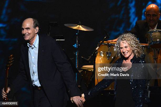 Honoree Carole King and musician James Taylor perform onstage at 2014 MusiCares Person Of The Year Honoring Carole King at Los Angeles Convention...