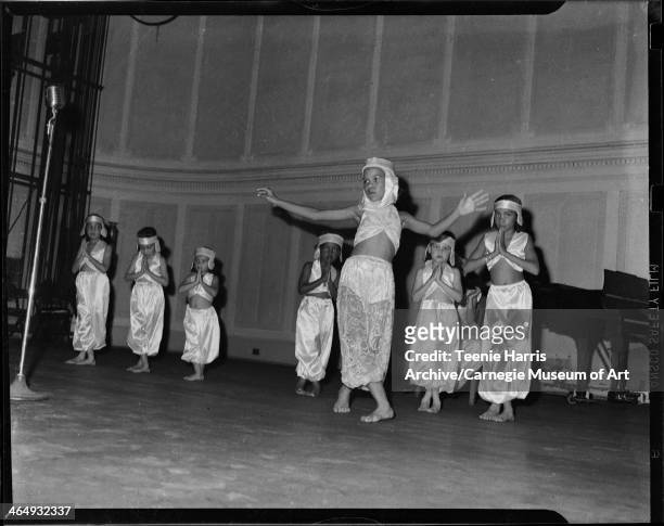 Dancers Mary Eaton, Patricia L Chavis, Relda K Tames, unknown wearing sheer vine patterned pants, Lendia O Jackson, and Betty Love, performing for...
