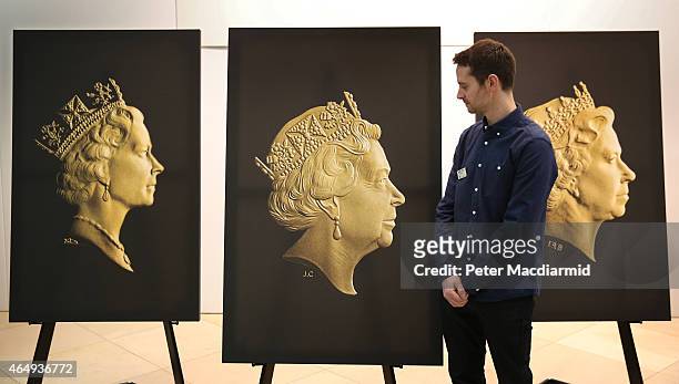 Royal Mint Engraver Jodie Clark looks at the new coinage portrait of Queen Elizabeth II at The National Portrait Gallery on March 2, 2015 in London,...
