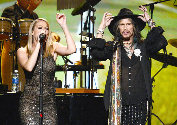 Singers LeAnn Rimes and Steven Tyler perform onstage at 2014 MusiCares Person Of The Year Honoring Carole King at Los Angeles Convention Center on...