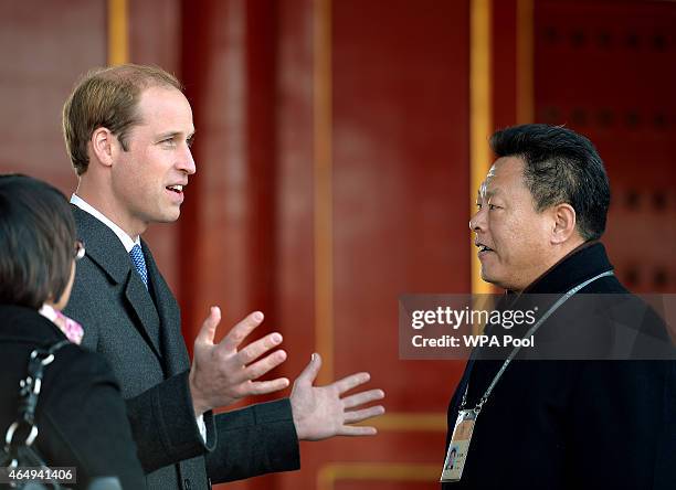 Prince William, Duke of Cambridge with Mr Zhang Yaoguang the Vice-Director of Foreign Affairs at the Forbidden City as they tour the Courtyards of...