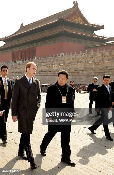 Prince William, Duke of Cambridge with Mr Zhang Yaoguang the Vice-Director of Foreign Affairs at the Forbidden City as they tour the Courtyards of...