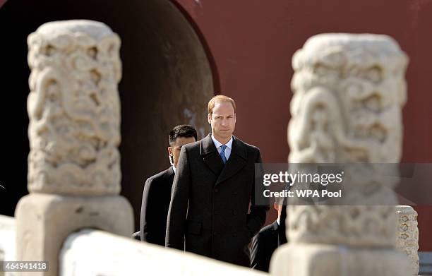 Prince William, Duke of Cambridge crosses a stone bridge during a tour of the Courtyards of the ancient Forbidden City on March 2, 2015 in Beijing,...