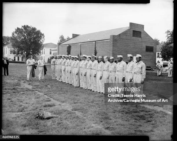 Group portrait of US Army doctors, standing in line at Field Service school at Carlisle Barracks, Carlisle, Pennsylvania, 1942. From left: James D...