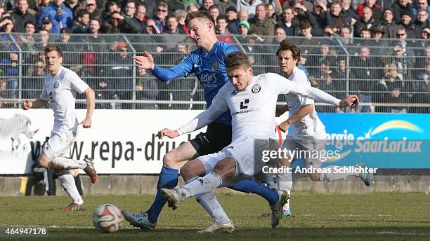 Mijo Tunjic of Elversberg with Steffen SchÃ¤fer of Saarbruecken during the Regionalliga Suedwest match between SV Elversberg and 1. FC Saarbruecken...