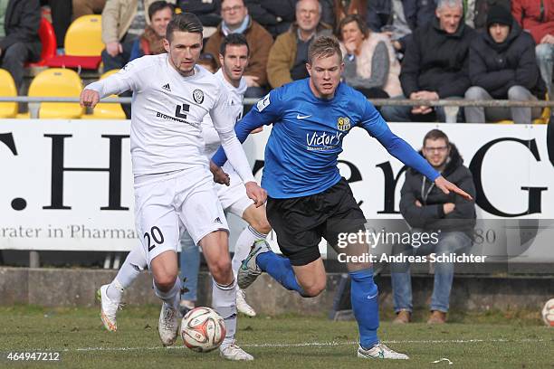 Mijo Tunjic of Elversberg with Daniel Doeringer of Saarbruecken during the Regionalliga Suedwest match between SV Elversberg and 1. FC Saarbruecken...