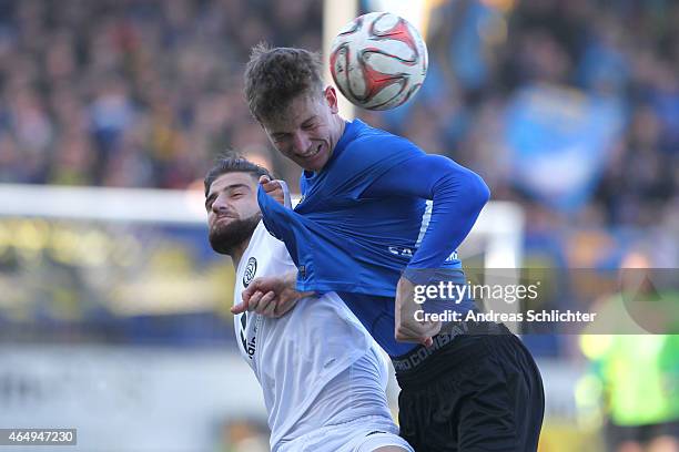 Antonyos Celik of Elversberg with Steffen SchÃ¤fer of Saarbruecken during the Regionalliga Suedwest match between SV Elversberg and 1. FC...