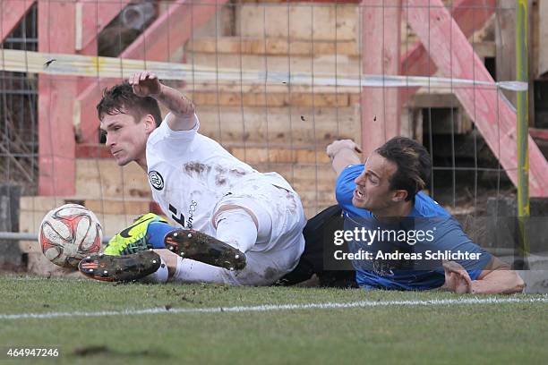 Thomas Birk of Elversberg with Felix Luz of Saarbruecken during the Regionalliga Suedwest match between SV Elversberg and 1. FC Saarbruecken on...