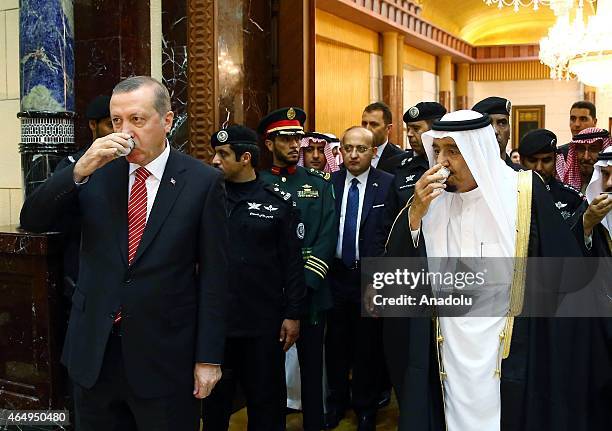 Turkish President Recep Tayyip Erdogan and King of Saudi Arabia, Salman bin Abdulaziz Al Saud drink Arabic Coffee ahead of their meeting at Riyadh's...