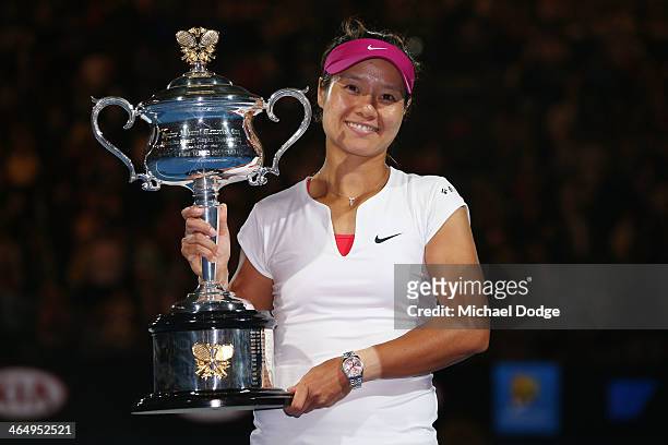 Na Li of China holds the Daphne Akhurst Memorial Cup after winning the women's final match against Dominika Cibulkova of Slovakia during day 13 of...
