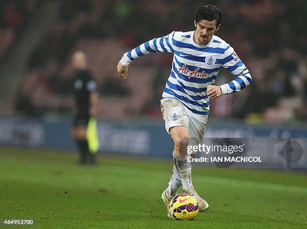 Queens Park Rangers' English midfielder Joey Barton plays the ball during the English Premier League football match between Sunderland and Queens...