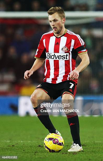 Sunderland's Swedish midfielder Sebastian Larsson plays the ball during the English Premier League football match between Sunderland and Queens Park...