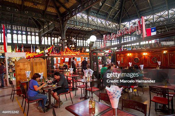 Tourists and locals have lunch at one of the traditional restaurants of Santiago Central Market on February 28th, 2015 in Santiago de Chile, Chile....