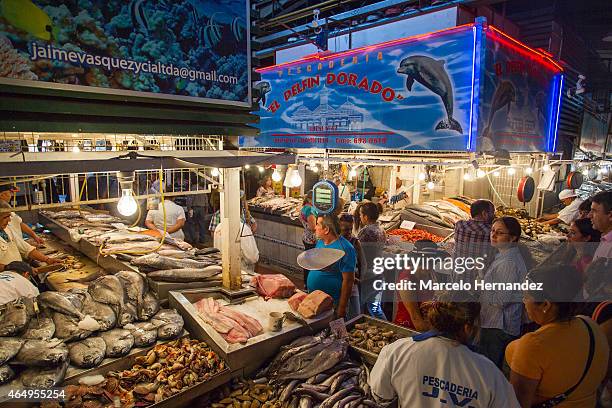 Tourists and locals walk around the Santiago Central Market on February 28th, 2015 in Santiago de Chile, Chile. The Central Market is a traditional...