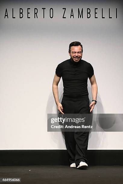 Designer Albero Zambelli acknowledges the applause of the audience at the Alberto Zambelli show during the Milan Fashion Week Autumn/Winter 2015 on...