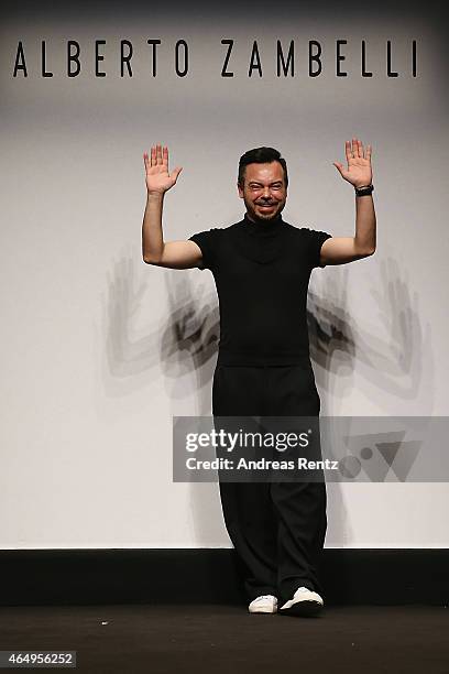 Designer Albero Zambelli acknowledges the applause of the audience at the Alberto Zambelli show during the Milan Fashion Week Autumn/Winter 2015 on...