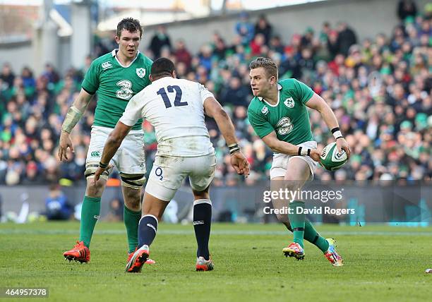 Ian Madigan of Ireland passes the ball during the RBS Six Nations match between Ireland and England at the Aviva Stadium on March 1, 2015 in Dublin,...