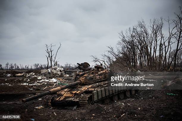 Ukrainian tank sits destroyed in an entrenched battlefield where the Ukrainian army was defeated by pro-Russian rebels on March 2, 2015 on the...