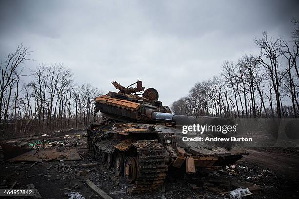 Ukrainian tank sits destroyed in an entrenched battlefield where the Ukrainian army was defeated by pro-Russian rebels on March 2, 2015 on the...