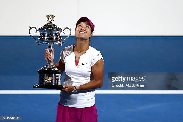 Na Li of China holds the Daphne Akhurst Memorial Cup after winning the women's final match against Dominika Cibulkova of Slovakia during day 13 of...