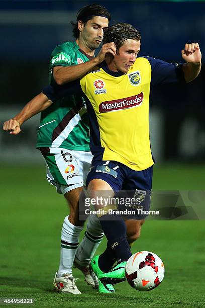Nick Fitzgerald of the Mariners competes with Zenon Caravella of the Jets during the round 16 A-League match between the Central Coast Mariners and...