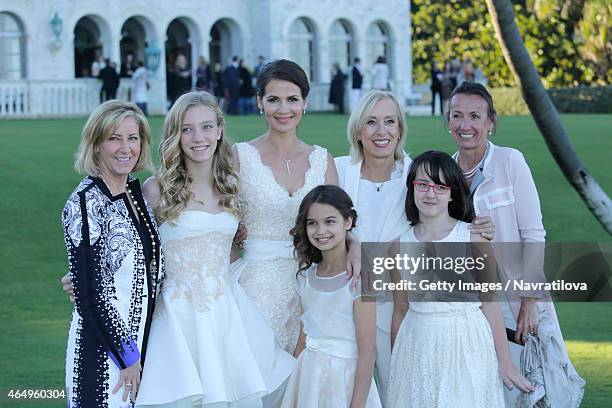 Chris Evert, Julie Lemigova, Martina Navratilova, daughters Victoria and Emma, Jana Navratilova and guest pose at the Martina Navratilova and Julie...