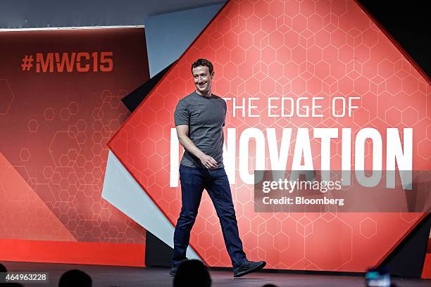 Mark Zuckerberg, co-founder and chief executive officer of Facebook Inc., arrives on stage for a keynote session at the Mobile World Congress in...