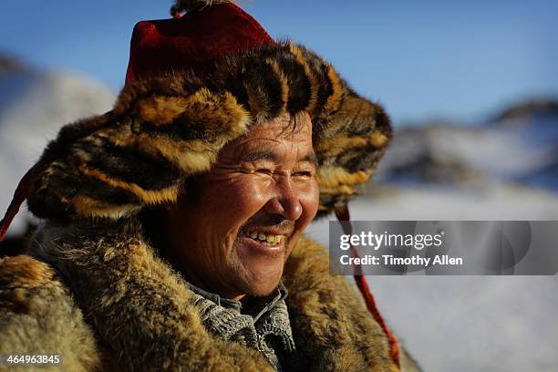 kazakh golden eagle hunter laughing - mongolian culture stock pictures, royalty-free photos & images