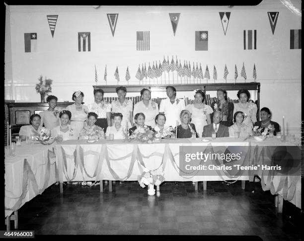 Poro Beauty School graduates, posed at banquet table in Kay Boys' Club, Pittsburgh, Pennsylvania, October 1, 1945. Seated from left: Fannie Wilson,...