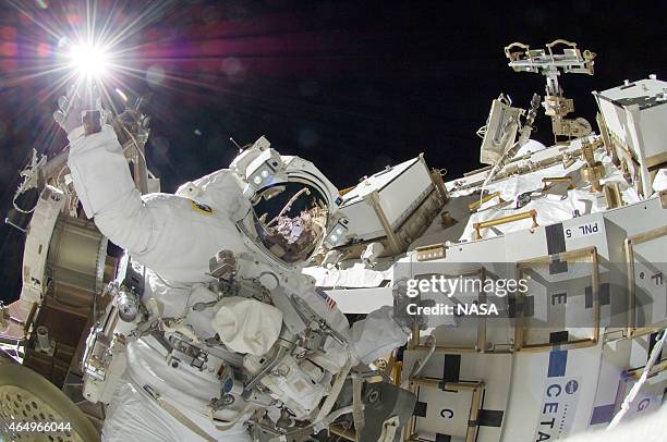 In this handout from National Aeronautics and Space Administration or NASA, NASA astronaut Sunita Williams, Expedition 32 flight engineer, raises her...