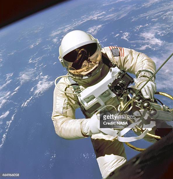 In this handout from National Aeronautics and Space Administration or NASA, NASA Astronaut Ed White floats out of the hatch of his Gemini 4 capsule...