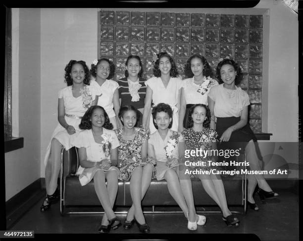 Schenley High School graduates, posed in Loendi Club, Pittsburgh, Pennsylvania, June 1945. Seated from left: Juanita Taylor, Doris Clark, Eugenia...