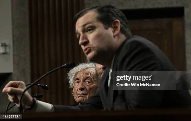 Nobel Peace Laureate Elie Wiesel listens as Sen. Ted Cruz speaks during a roundtable discussion on Capitol Hill March 2, 2015 in Washington, DC....