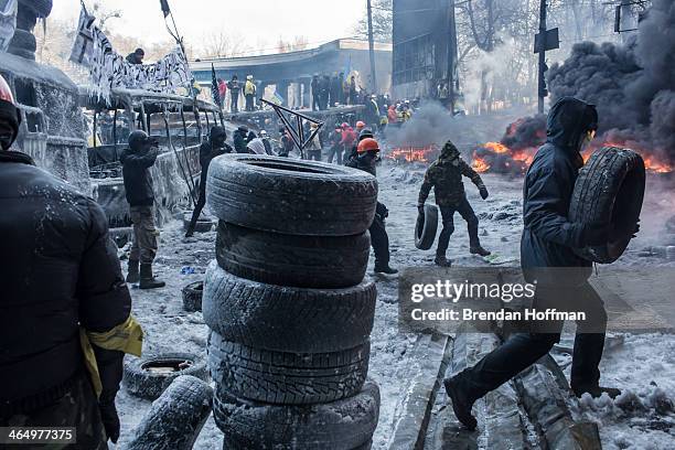 Anti-government protesters burn tires during clashes with police on Hrushevskoho Street near Dynamo stadium on January 25, 2014 in Kiev, Ukraine....