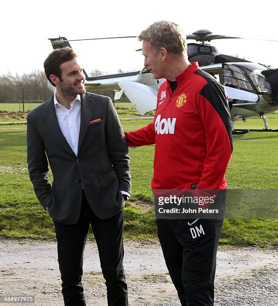 Manager David Moyes of Manchester United welcomes Juan Mata ahead of his medical at Aon Training Complex on January 25, 2014 in Manchester, England.