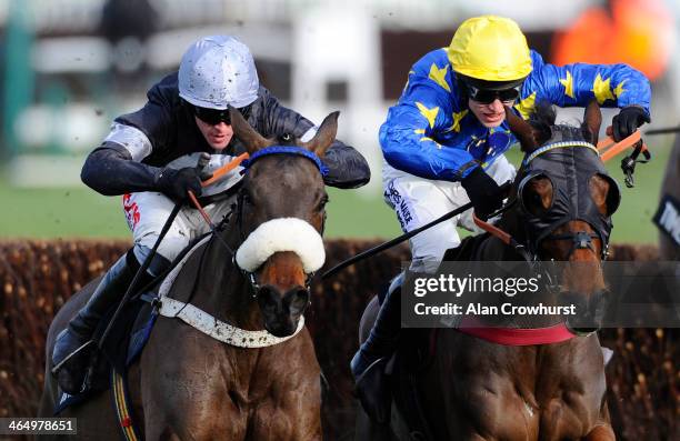 Jason Maguire riding Indian Castle clear the last to win The Timeform Novices' handicap Steeple Chase at Cheltenham racecourse on January 25, 2014 in...