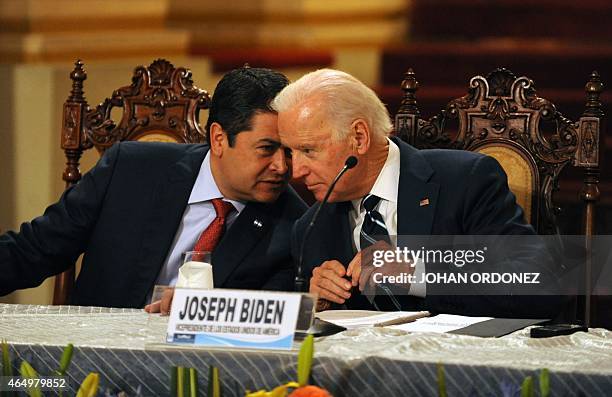 Honduran President Juan Orlando Hernandez speaks with US Vice-President Joe Biden during a press conference at the Culture Palace in Guatemala City...