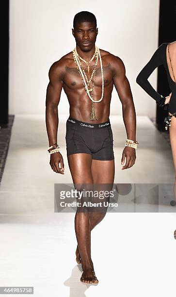 Model walks the runway at the Accessories Premier runway show featuring Tsion Rocks collection during Mercedes-Benz Fashion Week Fall 2015 on...