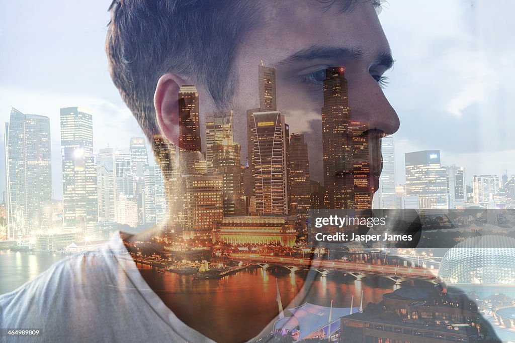 Composite of mans head and cityscape