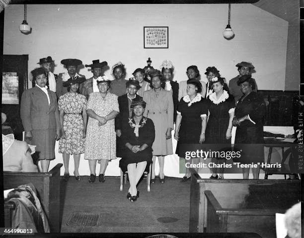 Members of the Woman's Missionary Society of the AME Church, posed in front of altar in Speer Street AME Church, Belle Vernon, Pennsylvania, April...