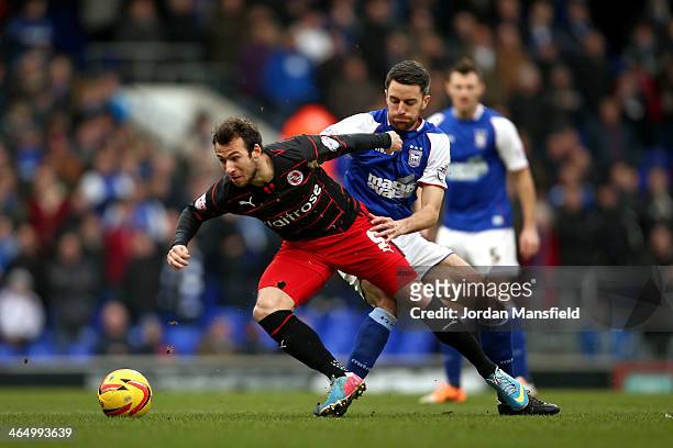 Adam Le Fondre of Reading and Cole Skuse of Ipswich tackle for possession during the Sky Bet Championship match between Ipswich Town and Reading at...